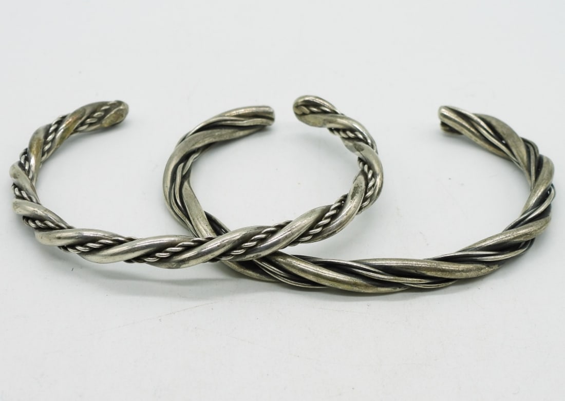 Two Sterling Twisted Bangle Bracelets: Two sterling twisted bangle bracelets. (23.5 dwt) (6x4x2)