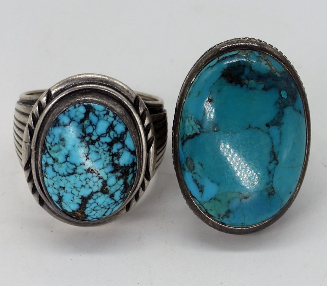 2 Turquoise Sterling Rings: Two sterling turquoise rings. Sizes 7 & 12. (17.9 dwt)