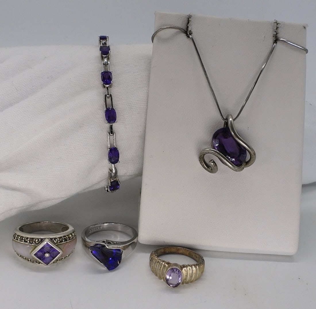 Amethyst Sterling Rings & More: Amethyst gemstones set in sterling silver. Necklace is 18" long. Bracelet is 7". Three rings, size 6-8. (18 dwt)