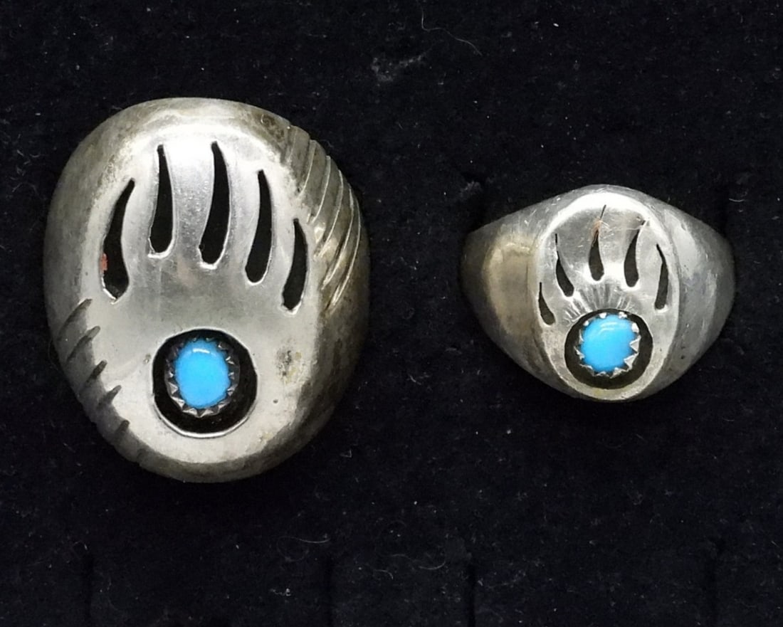 2 Sterling Bear Paw Navajo Turquoise Rings: Two sterling Bear Paw Navajo Turquoise rings, sizes 10 and 12. Smaller ring marked with "R", larger ring marked with "P". (16 dwt)