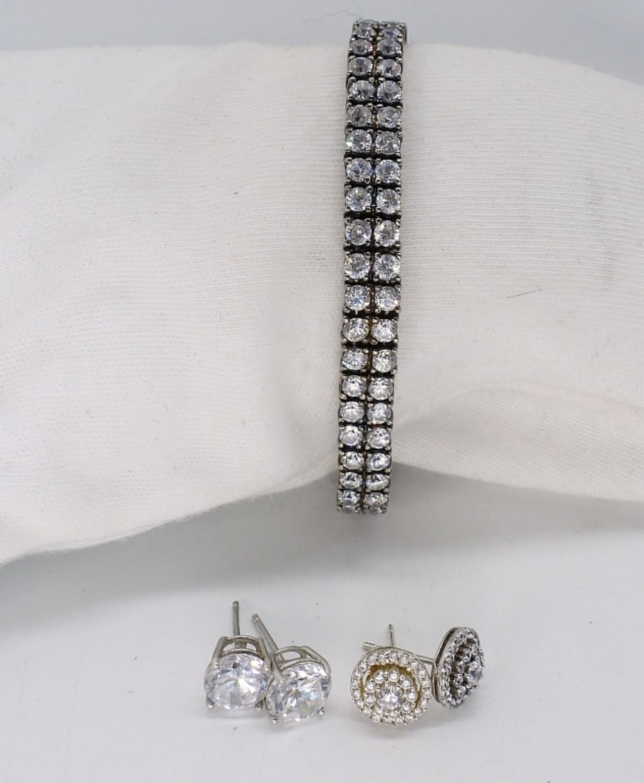 Gorgeous Simulated Diamond Earrings & More: Gorgeous sterling simulated diamond earrings (two pair pierced) and tennis bracelet, 7" long. (18 dwt)