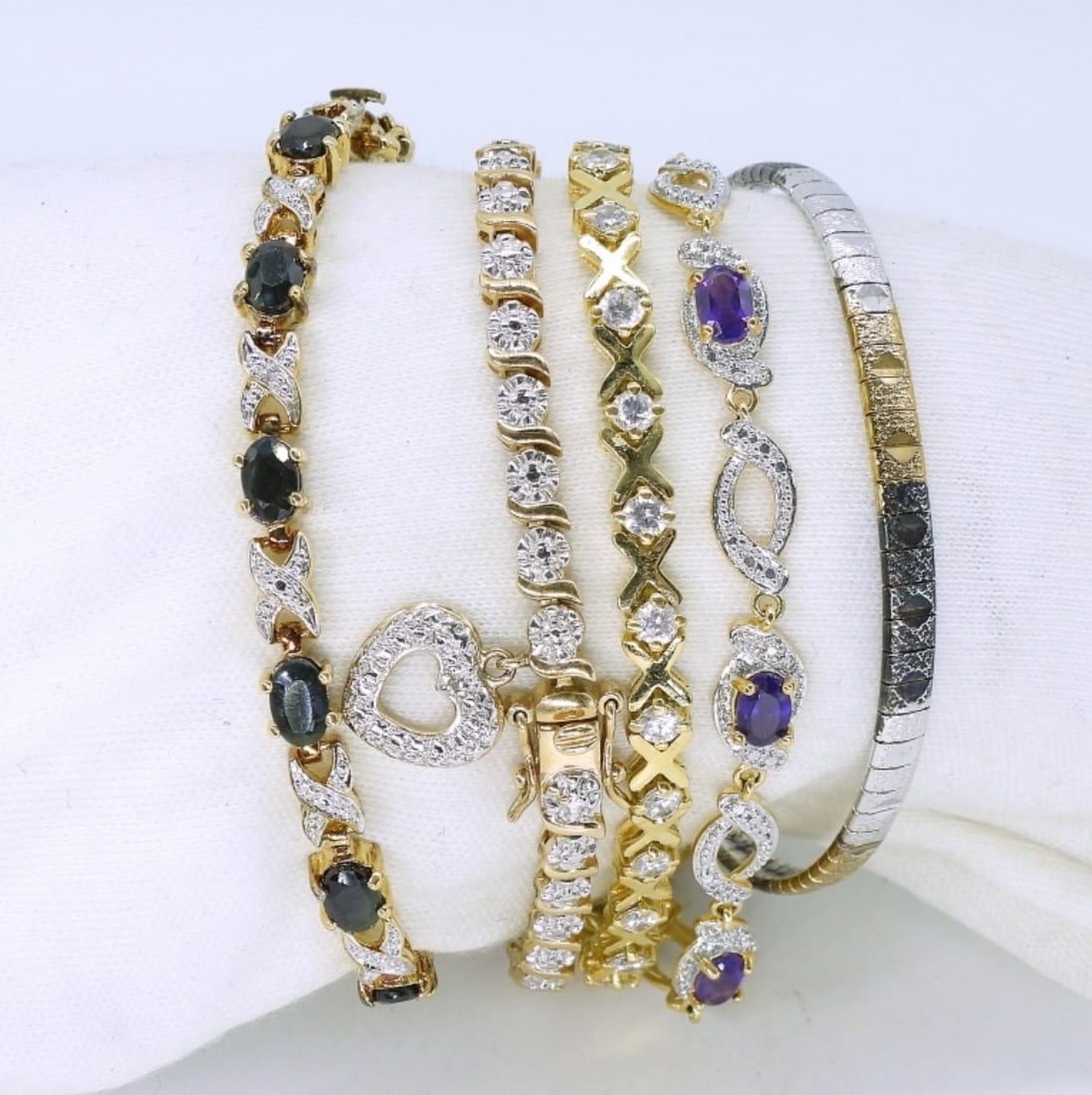 5 Sterling Gold Tone Tennis Bracelets: Five sterling bracelets, gold toned. 7" long. (33.4 dwt) (6x4x2)