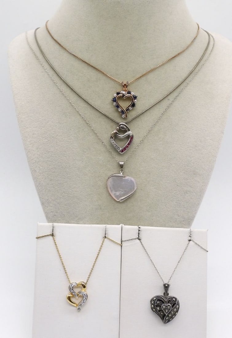 5 Sterling Heart Fashion Necklaces: Five sterling and gold tone fashion heart shaped necklaces. Chains are 16" & 18" long. (13.9 dwt)