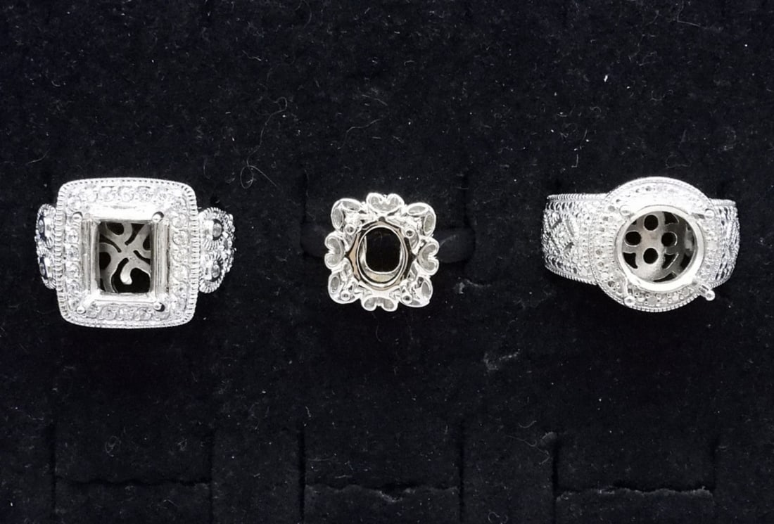 3 Sterling Semi-Mount Ring Settings: Three sterling semi-mount ring settings. Ring sizes are 7 & 8. (12.3 dwt)