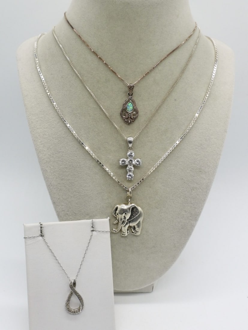 Diamond 925 Necklace & 3 Other Necklaces: One sterling diamond necklace with very low quality, cloudy diamonds, 21" chain. Three other sterling necklaces with simulated diamonds and opal. Chains are 18", 20" & 24". (17.7 dwt)