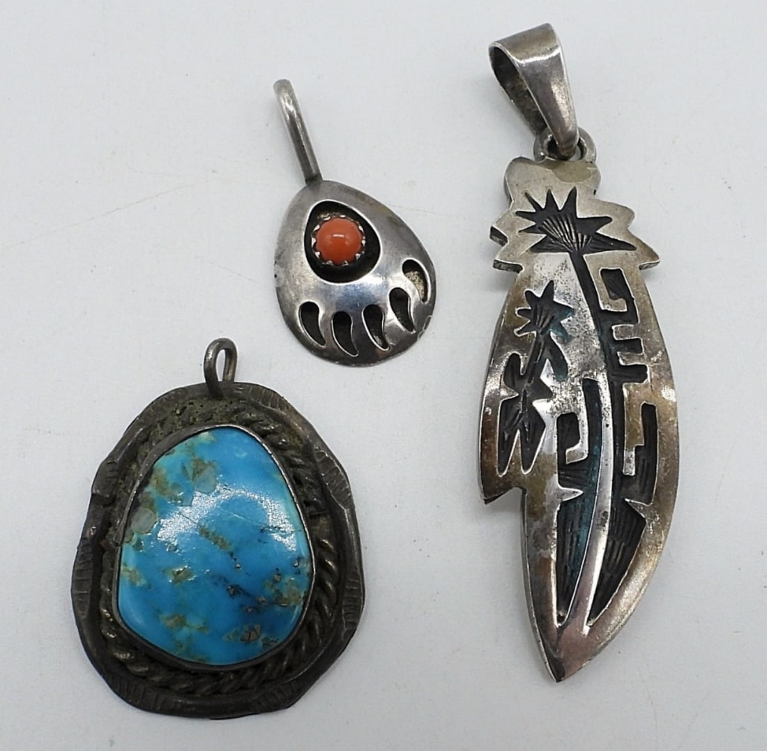 3 Sterling Southwest Pendants, Turquoise: Three sterling southwest pendants with turquoise and red coral. 1-2" long. (10 dwt)