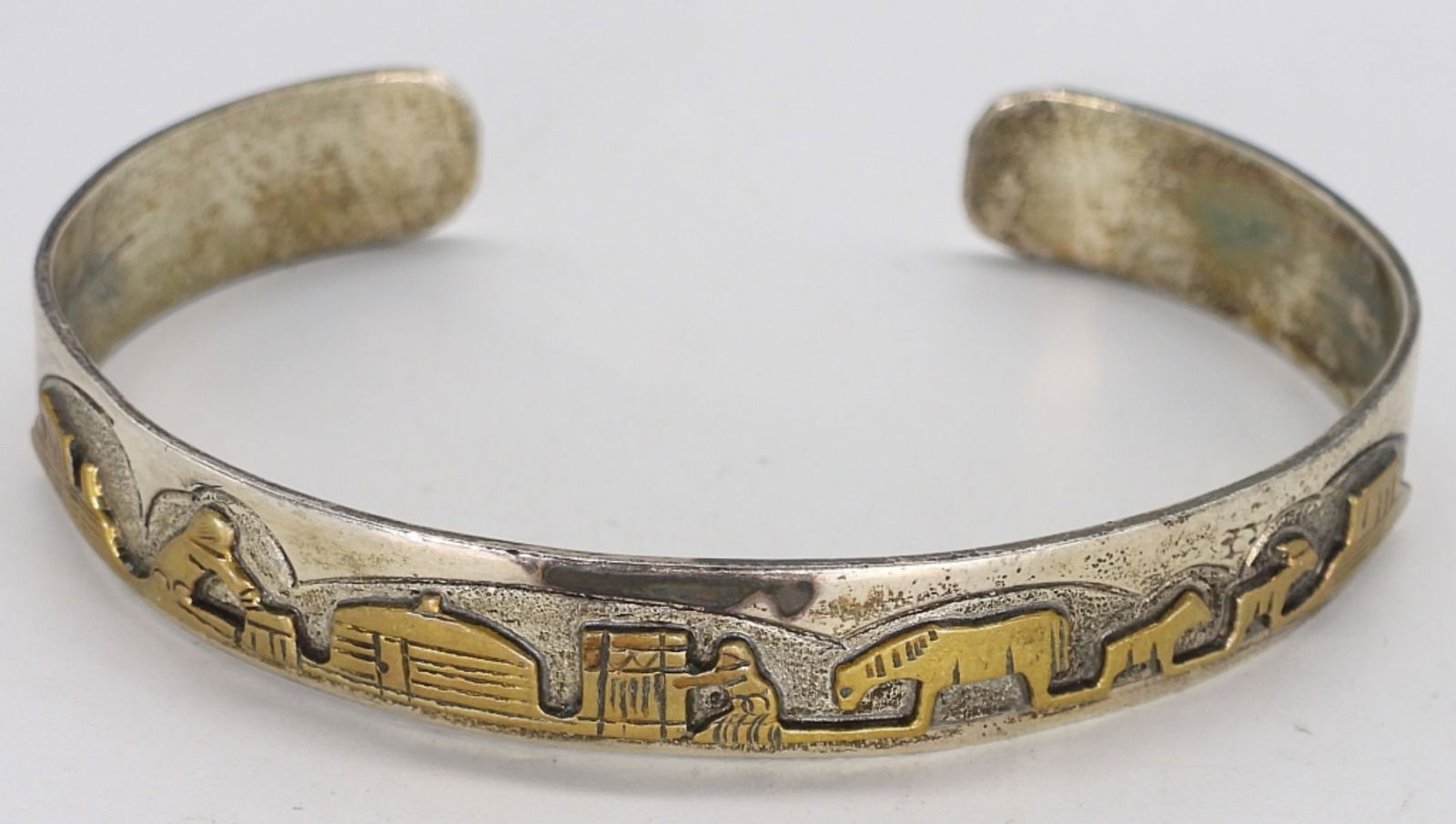 Jacob Kahe Sterling Navajo Cuff Bracelet: Jacob Kahe sterling and gold tone Navajo cuff bracelet, signed "sterling KK". (9.8 dwt)
