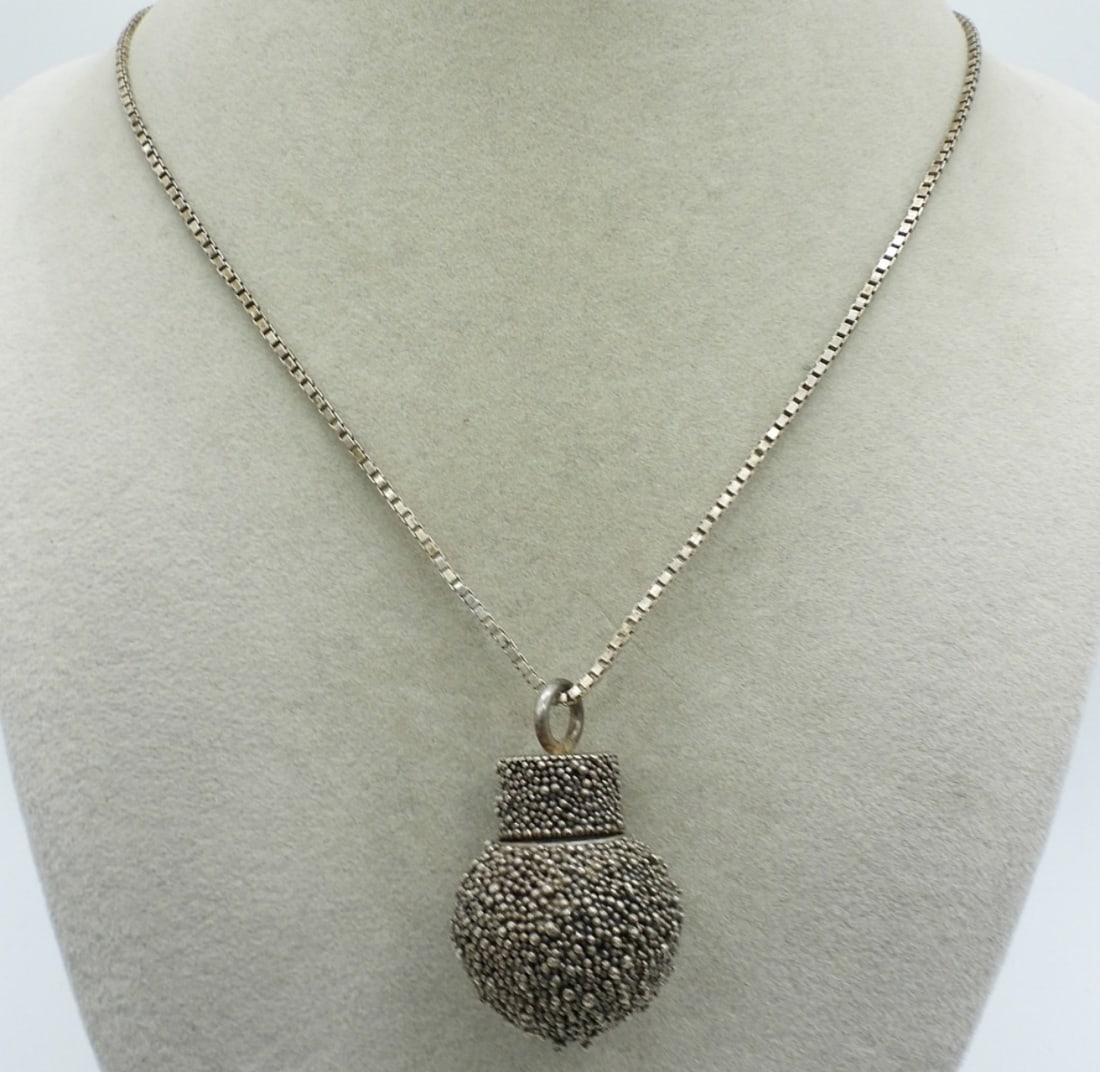 Sterling Perfume Pendant Necklace: Sterling perfume pendant necklace. Pendant measures 1.5". Sterling chain is 29" long. (17.8 dwt)