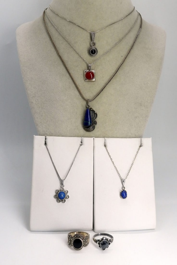 Onyx, Star Sapphire, Lapis Necklaces & More: Five sterling silver gemstone necklaces & Two Sterling Rings. Black onyx, hematite, lapis lazuli (Navajo necklace), Blue Star Sapphire, Red Coral Gemstones. Chains are 18-20" long. Rings are