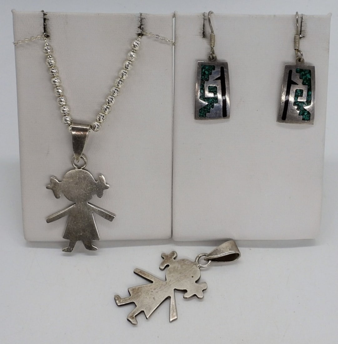 Taxco 925 Pendants & Earrings: Two matching little girl pendants, sterling Taxco, 2" long. One sterling chain, 18" long. Pierced sterling, turquoise inlay earrings, 1.5" long. (14.3 dwt)