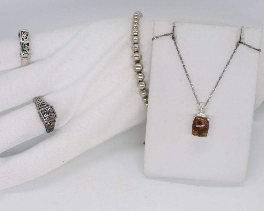 Fire Agate 925 Necklace & More: Sterling ring with a gorgeous fire agate gemstone on a 18" sterling chain. Two sterling rings, size 8 & 9. One is hinged (poison ring). Bracelet is 7" long. (13 dwt)