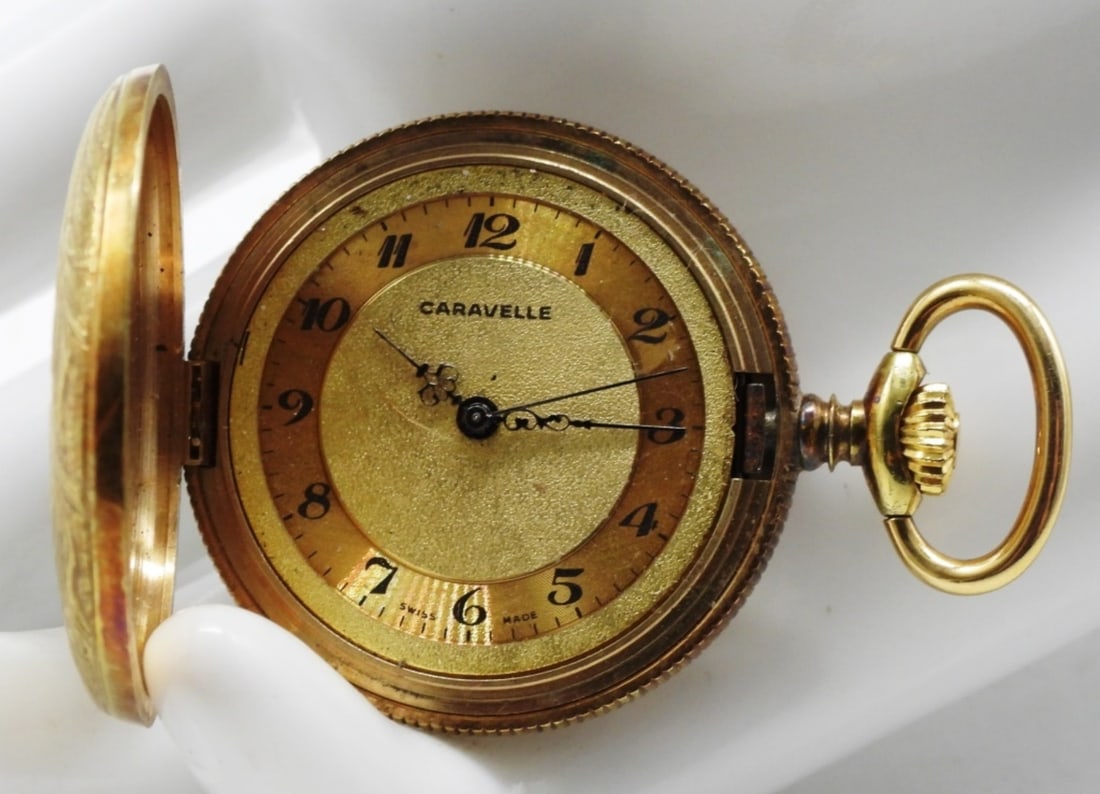 Caravelle "Full Hunter" Pocket Watch: Features a gold-tone case with 17 jewels. Swiss mechanical. Manual wind movement. Watches are not verified, authenticated, or tested in running condition unless otherwise specified.