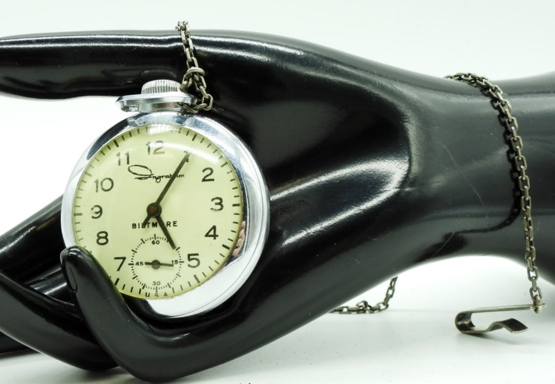 Ingrahm Biltmore Pocket Watch & Chain: This watch features a mechanical wind-up movement, a white dial with black Arabic numerals, and a sub-second dial located at the 6 o'clock position. Watches are not verified, authenticated, or