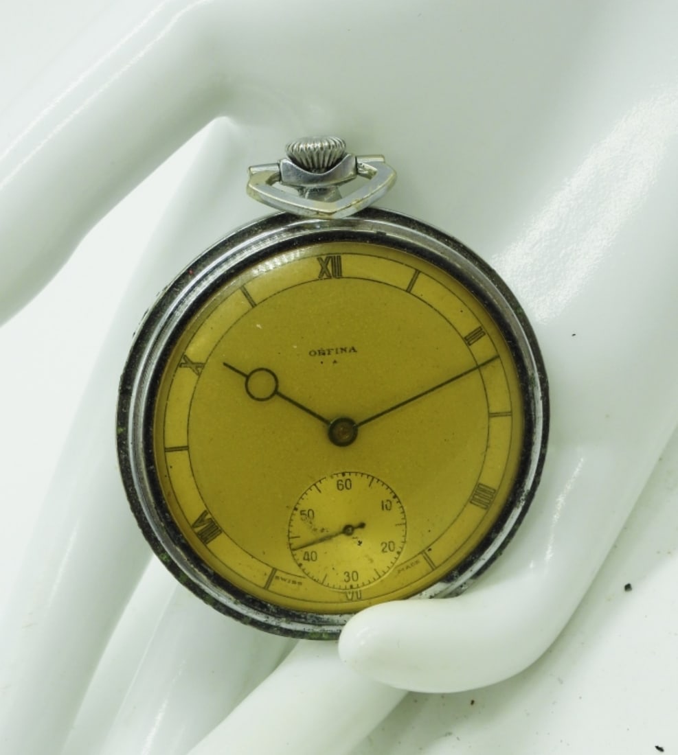 Orfina Pocket Watch: Featuring a yellow-toned face with Roman numerals and a small sub-dial at the 6 o'clock position. Watches are not verified, authenticated, or tested in running condition unless specified.