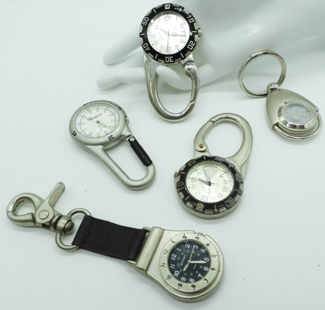 (5) Silver-Toned Key Chain Watches: Watches are not verified, authenticated, or tested in running condition unless otherwise specified. One is cracked needs repair.