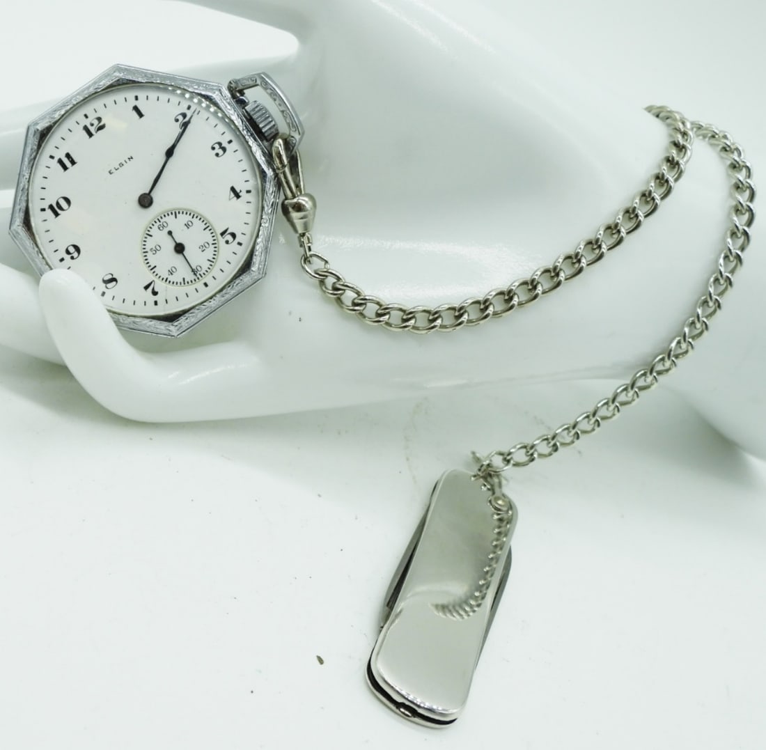 Elgin Pocket Watch: Working! Features a distinctive octagonal ("Spartan") case. Also comes with a gentleman's pocket knife. Watches are not verified, authenticated, or tested in running condition unless specified.