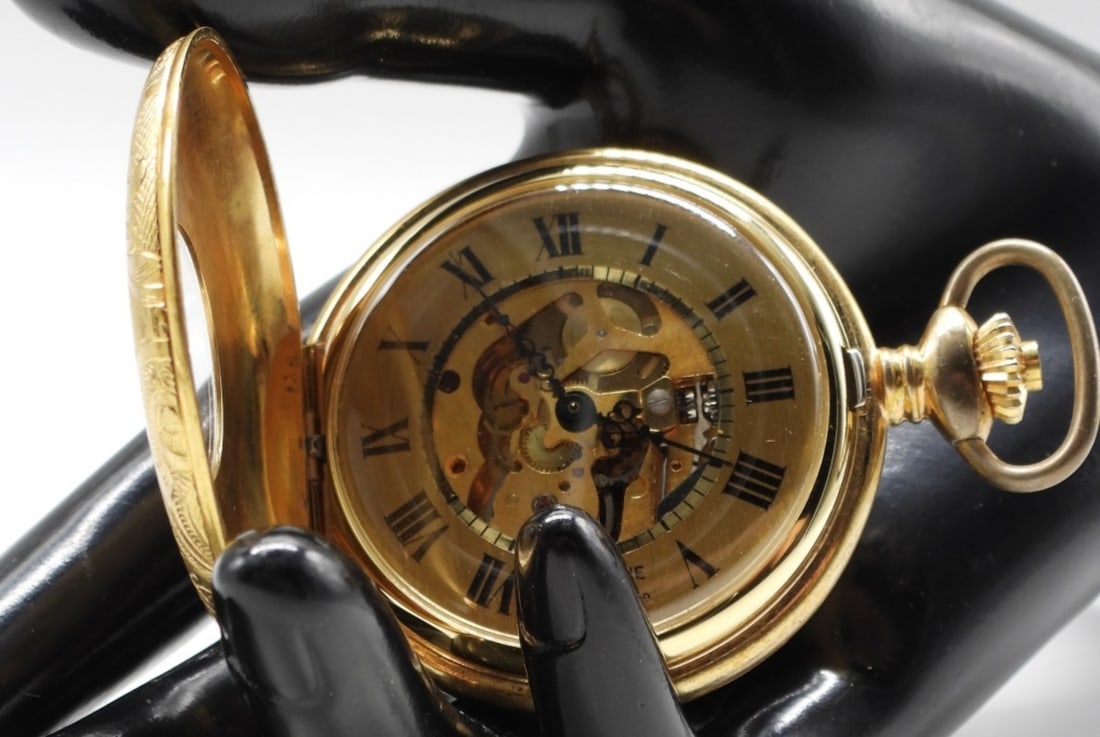 Half Hunter Pocket Watch: It features an ornate scrolling pattern, with a skeleton dial displaying the inner mechanical workings. Watches are not verified, authenticated, or tested in running condition unless specified.