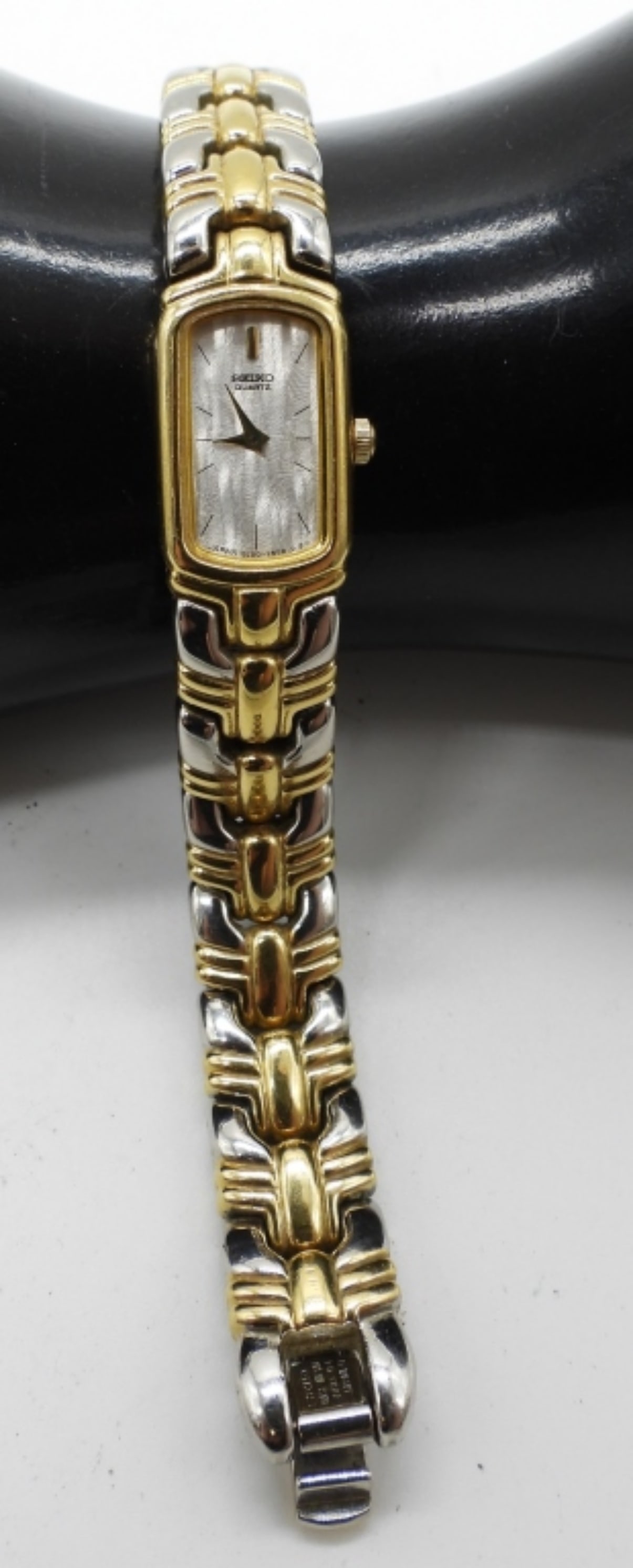 Seiko Quartz Dress Watch: Base metal. 2E20-7049 RO 380075. Watches are not verified, authenticated, or tested in running condition unless otherwise specified.