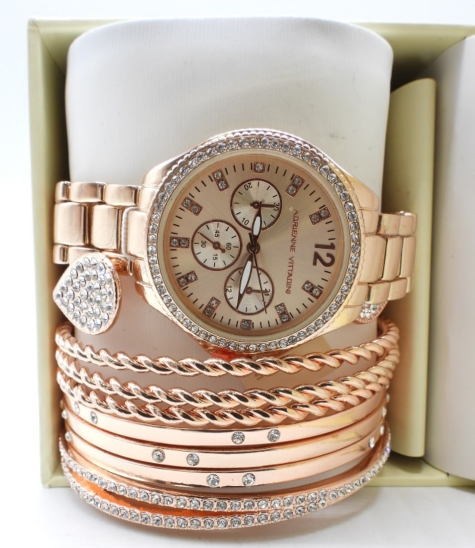 Adrienne Vittadini Watch & Bracelets In Box: Adrienne Vittadini, rose-gold-tone watch and bracelets, original tag and box. Watches are not verified, authenticated, or tested in running condition unless specified.