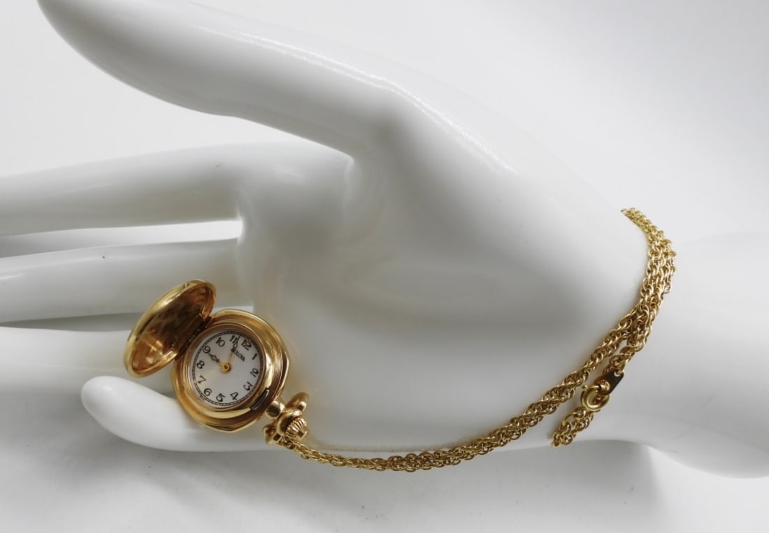 Bulova Gold-Tone Pendant Locket Watch Necklace: The chain is 24in long and 26in long with the pendant. Simple and perfect for any day wear. Watches are not verified, authenticated, or tested in running condition unless specified.