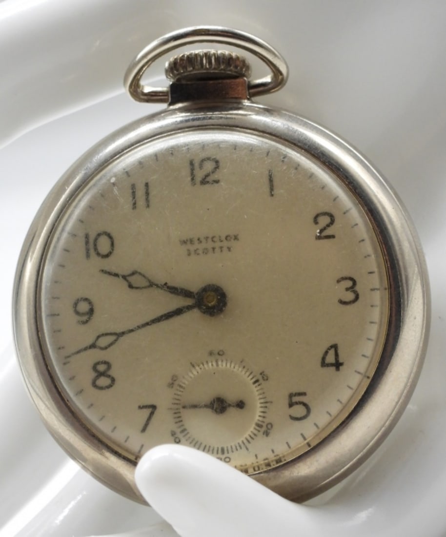 Westclox Scotty Pocket Watch: This is an open-faced watch with a white face and silver/chrome case. Watches are not verified, authenticated, or tested in running condition unless specified.