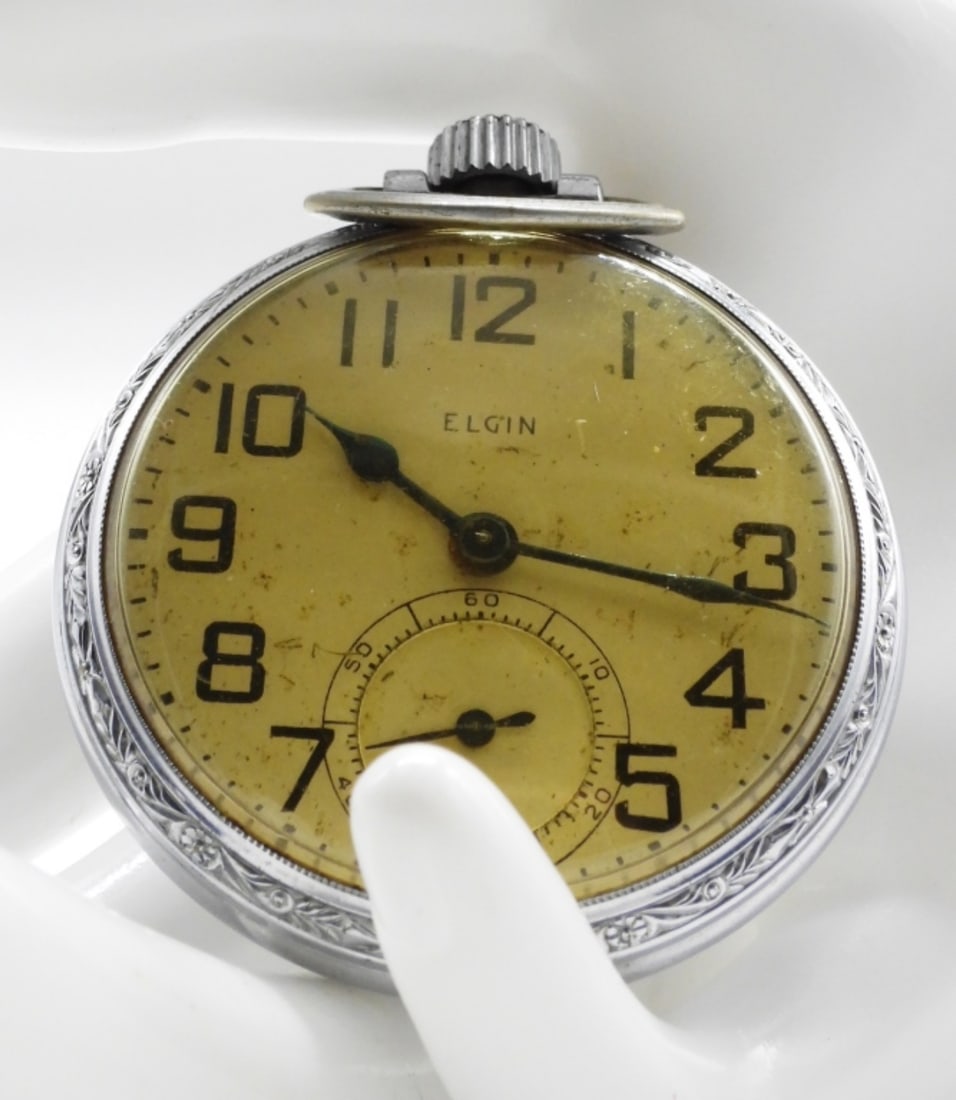 Elgin Open Face Pocket Watch: This watch features Arabic numerals and a sunken sub-second dial. Watches are not verified, authenticated, or tested in running condition unless specified.