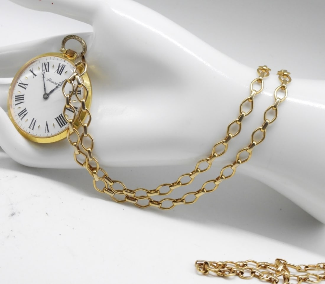 Dynasty Pocket Watch With Necklace: Working! This watch features a white face, gold-tone body, and chain, and Roman numerals. Watches are not verified, authenticated, or tested in running condition unless specified.