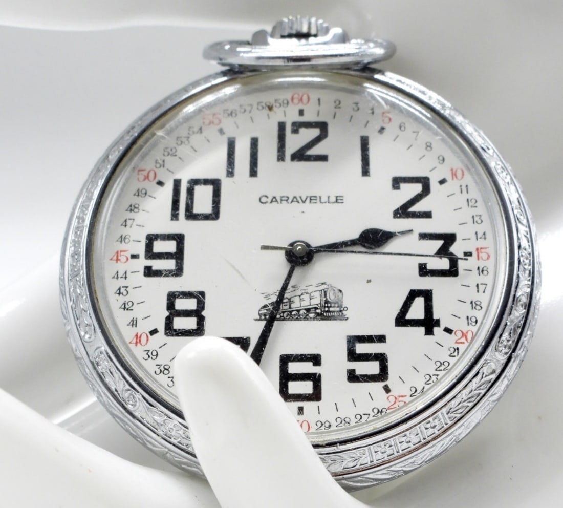Caravelle By Bulova Pocket Watch: This watch features an illustration of a train on the dial. (There is a crack in the crystal.) Watches are not verified, authenticated, or tested in running condition unless specified.