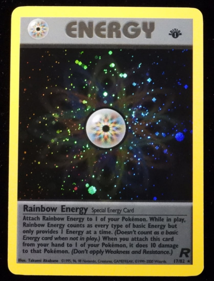 Rainbow Energy 1st Edition Holo Team Rocket: NM. 1999-2000. 1st Edition. Special Energy Card. Team Rocket. Rare, two swirls