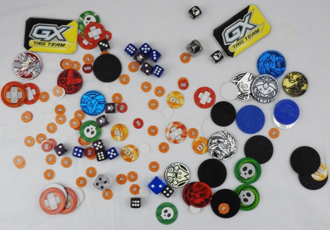 Mixed Lot Of Pokemon Game Pieces: Including 27 Markers Mega Charizard, Pokemon Gold Trader, Alolan Raichu, Coin Silver Holo Color, Pikachu Coin, 18 Small Dice, 3 Large Dice, & Cardboard Markers