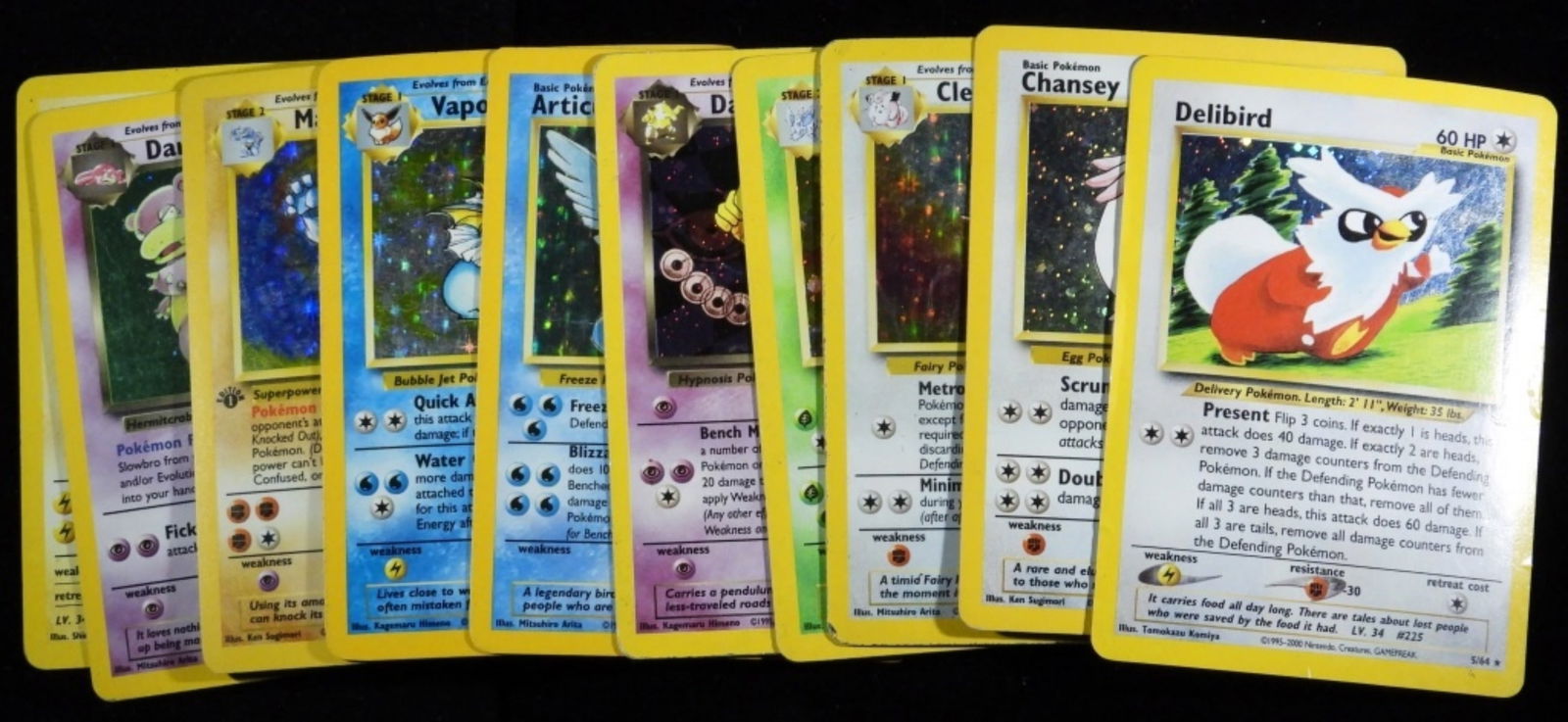 (10) Hologram Mixed Lot Pokemon Cards (G): In G condition with cards bent in and creases. Heavy played cards. Some cards in this lot are Delibird, Chansey, Clefable, Rocket's Zapdos, Dark Hypno and more. See photos