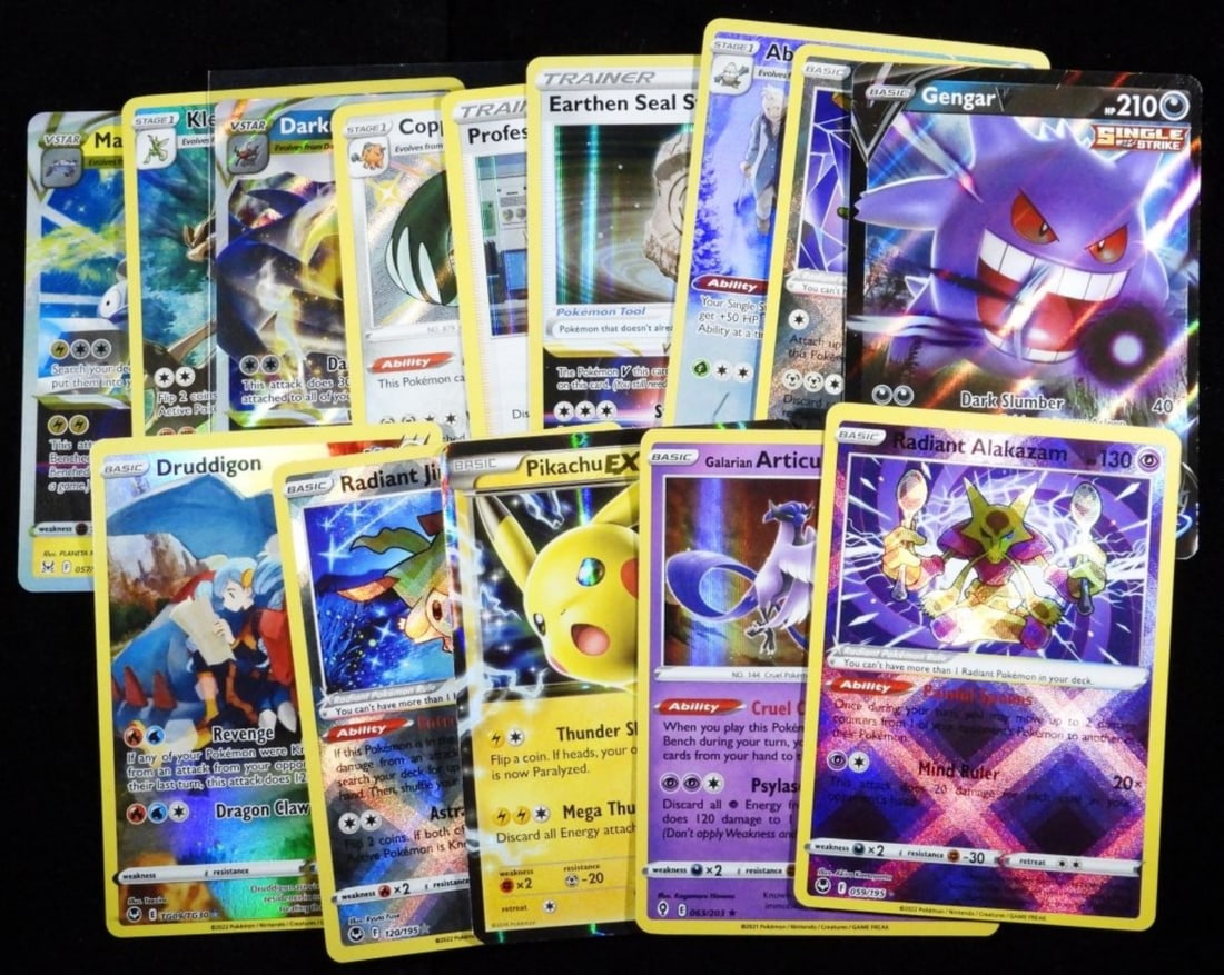 (14) Hologram Mixed Lot Pokemon Cards (G/VG): Conditions vary with each card. Between light and heavy play. Magnezone, Pikachu Ex, Radiant Jirachi, Druddigon, Gengar, Radiant Steelix, Abomasnow, and more
