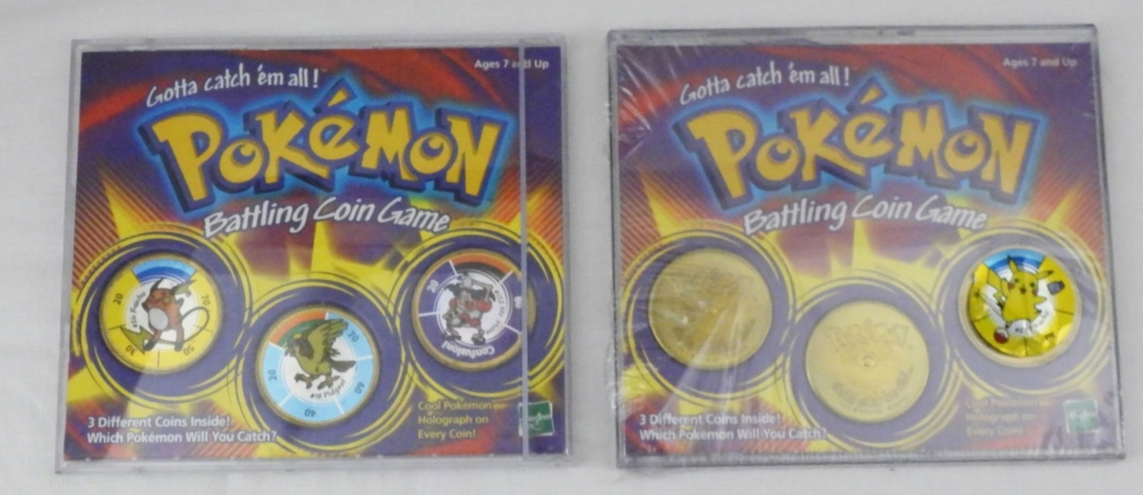 (2) Pokemon Battling Coin Game: 1 still sealed & 1 opened Raichu, Pidgeot, & Mr. Mime.