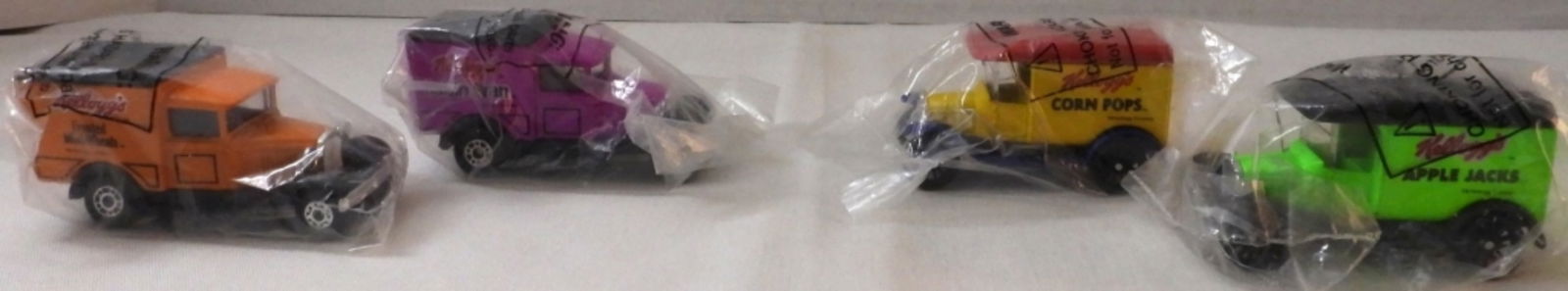 (4) Kellogg's Die-Cast Cars New In Packages: Corn Pops, Apple Jacks, Frosted Mini-Wheats, Raisin Bran