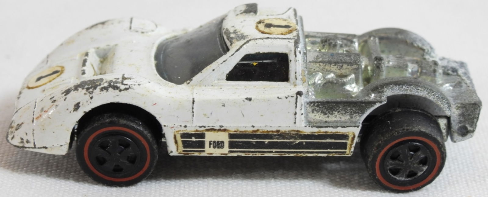Ford J-CarHot Wheels Redline: Missing the trunk piece, paint is chipping on the car, in fair condition