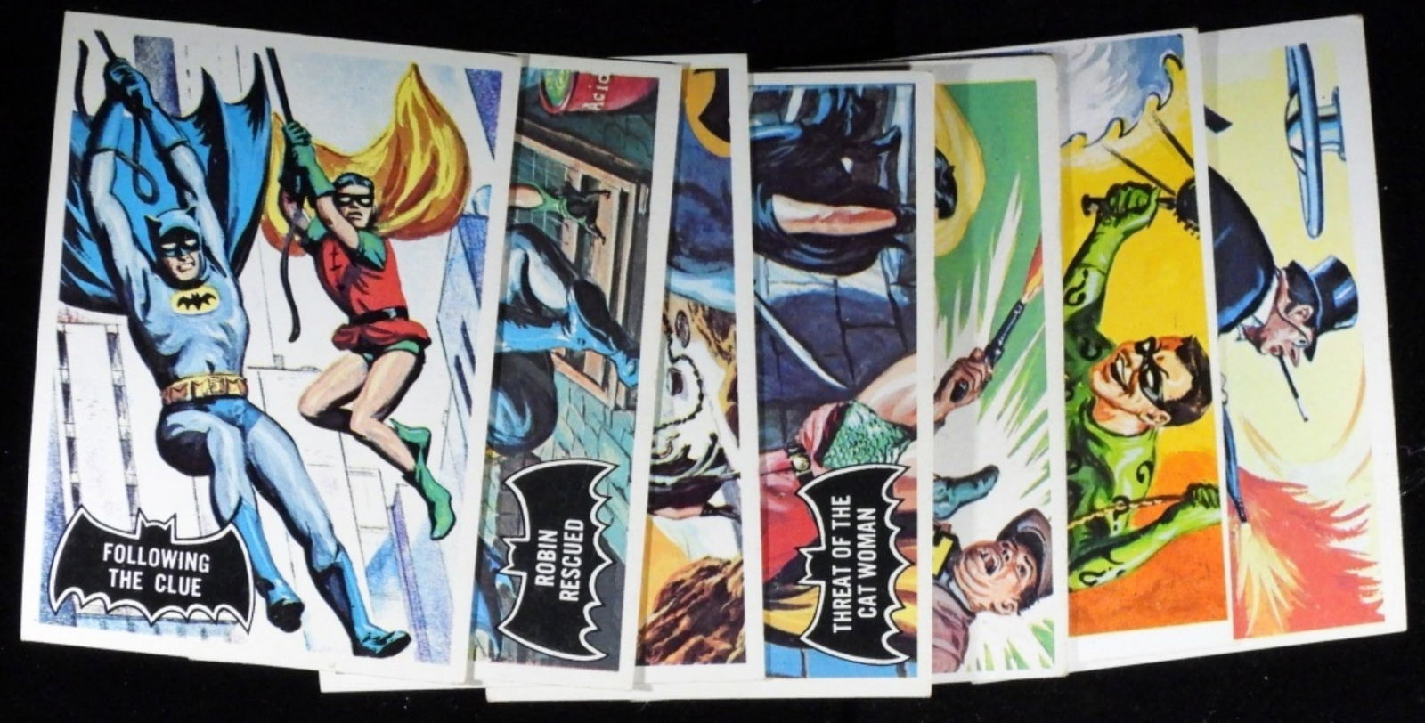 (7) Batman Black Bat Logo #19,30,31,34,38,40,42: All in various conditions (G/VG). 1966 TOPPS