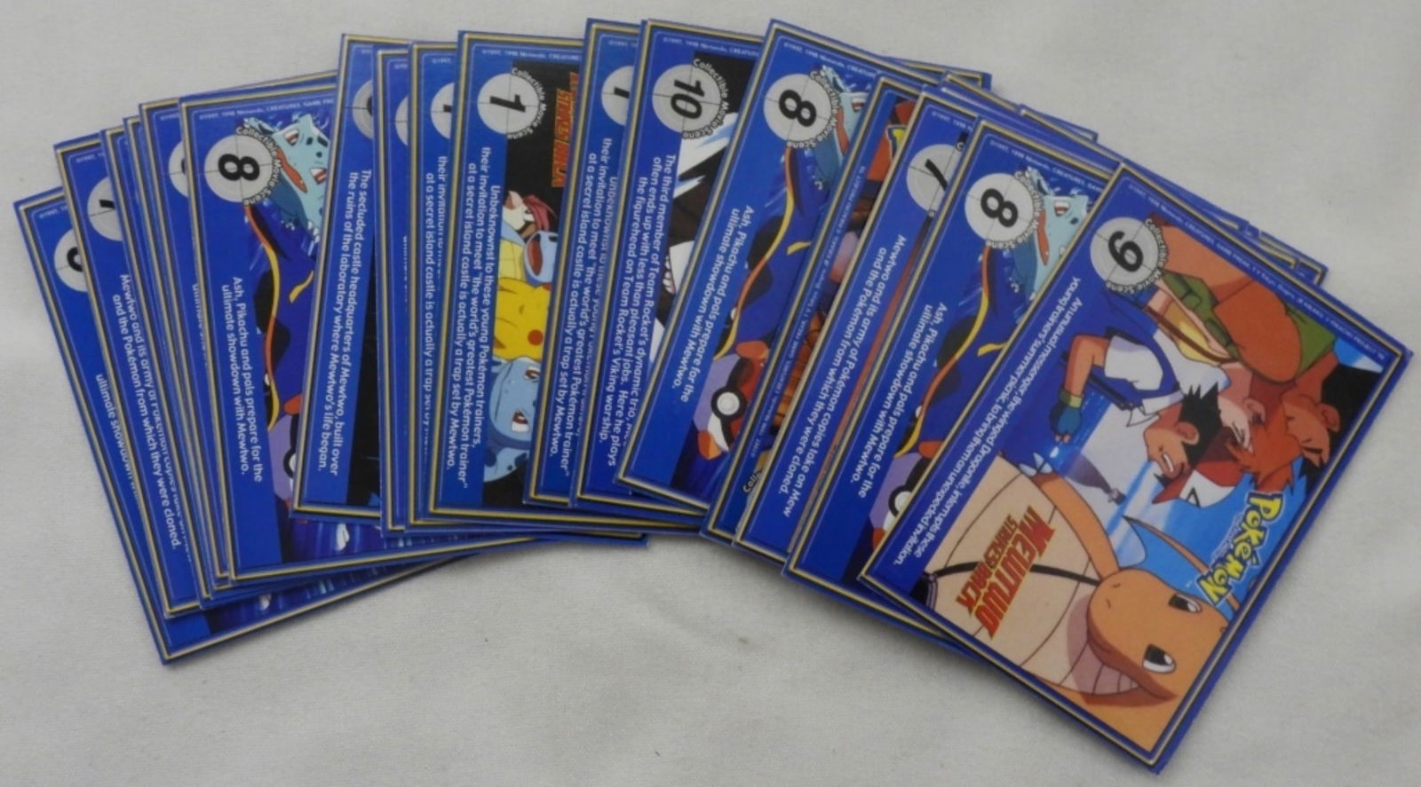 (26) PokeTivia Cards: Some duplicates, all in good condition. Some numbers include #104, #97, #116, and #117