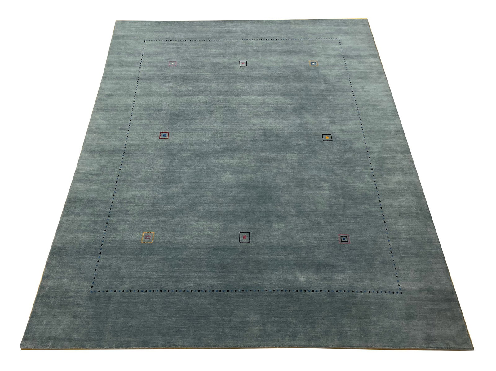 Persian Gabbeh S512 7'9" x 9'9" hand knotted minimalist contemporary teal: No Reserve Gabbeh S512 This 7'9" x 9'9" rug features a modern minimalist design with a solid teal-blue field and subtle geometric accents. Small, scattered square motifs in muted complementary colors�