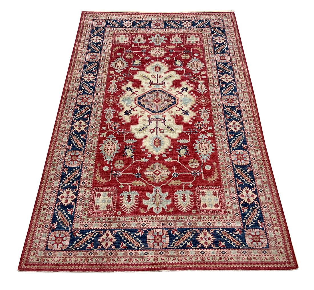 Persian Kazak D178 6'8"x10' hand knotted: No Reserve Kazak D178, size 6'8"x10'This rug showcases a vibrant Kazak design, celebrated for its bold geometric motifs and striking color palette. The rich crimson red field is adorned with a beautif
