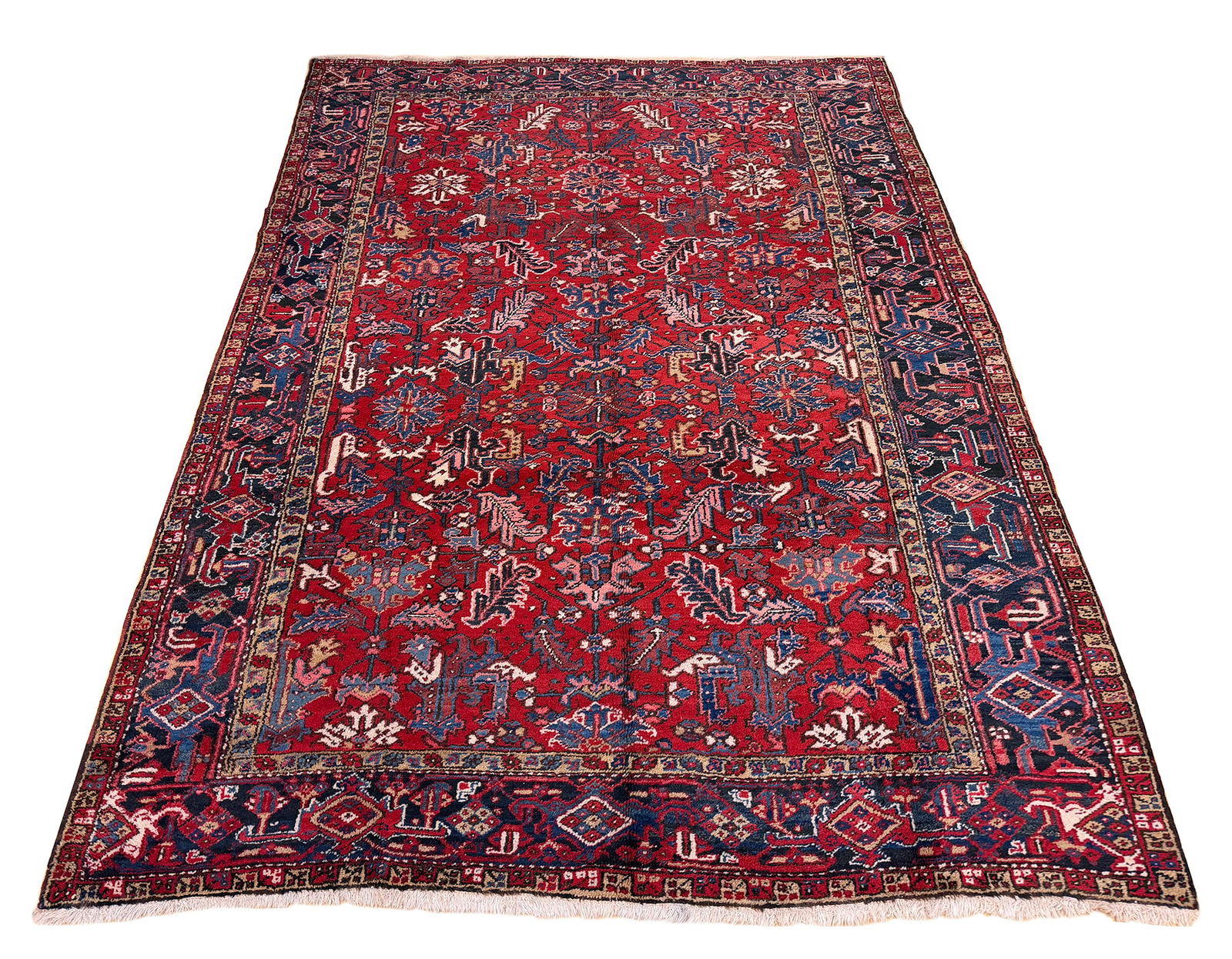 Persian Heriz Vintage S793 7'10" x 9'10" hand- knotted in Iran: No Reserve Persian Heriz S793, 7'10" x 9'10" wool rug, hand-knotted in Iran in the 1960s and in very good condition (see photos). This tribal Heriz runner exemplifies the bold geometric patterns and f