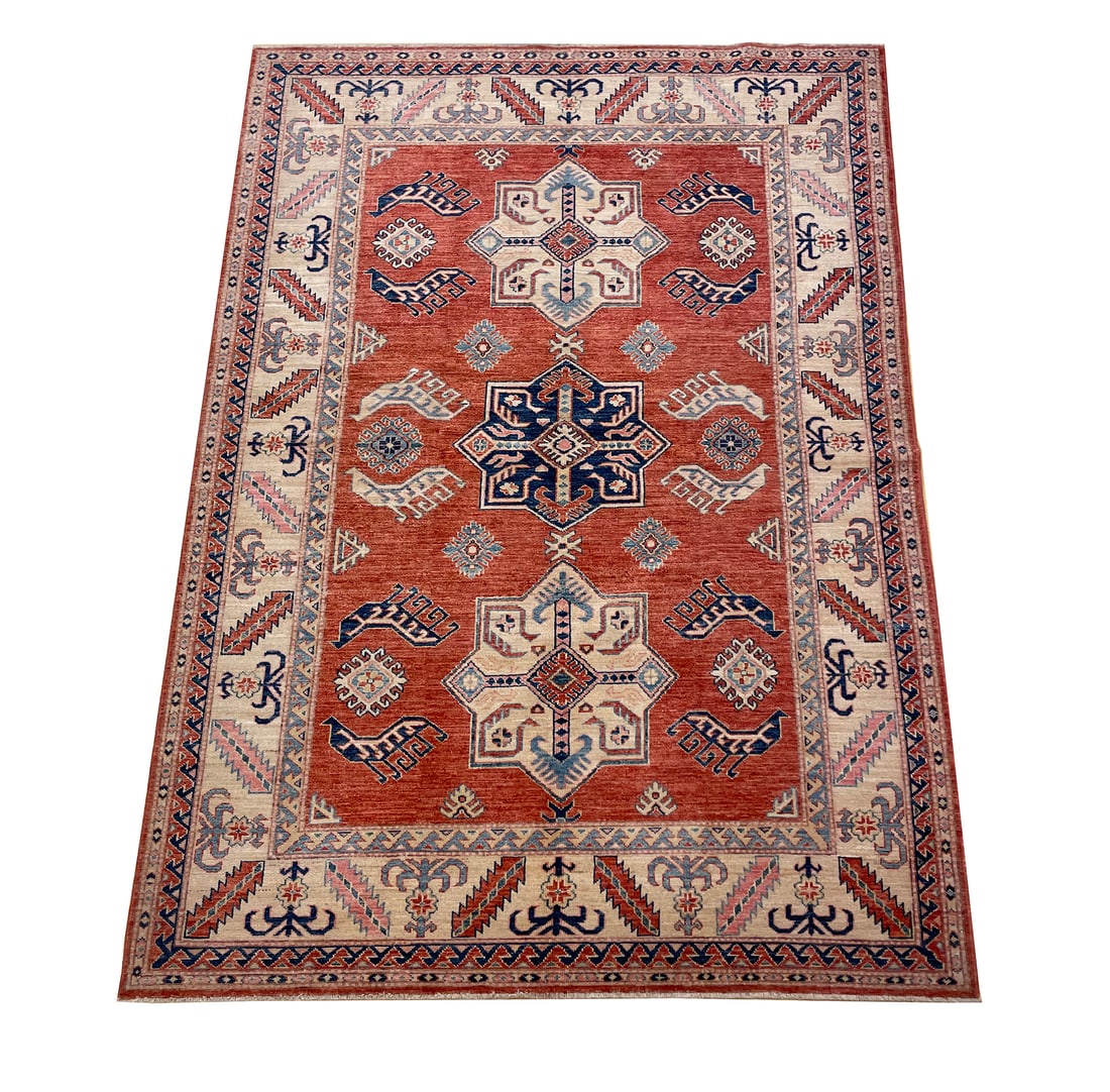 Persian Kazak D174 5'6" x 7'9" hand knotted: No Reserve Kazak D174 5'6" x 7'9"This rug features a classic Kazak design, celebrated for its bold geometric patterns and rich tribal heritage. The warm terracotta field is beautifully accented with i