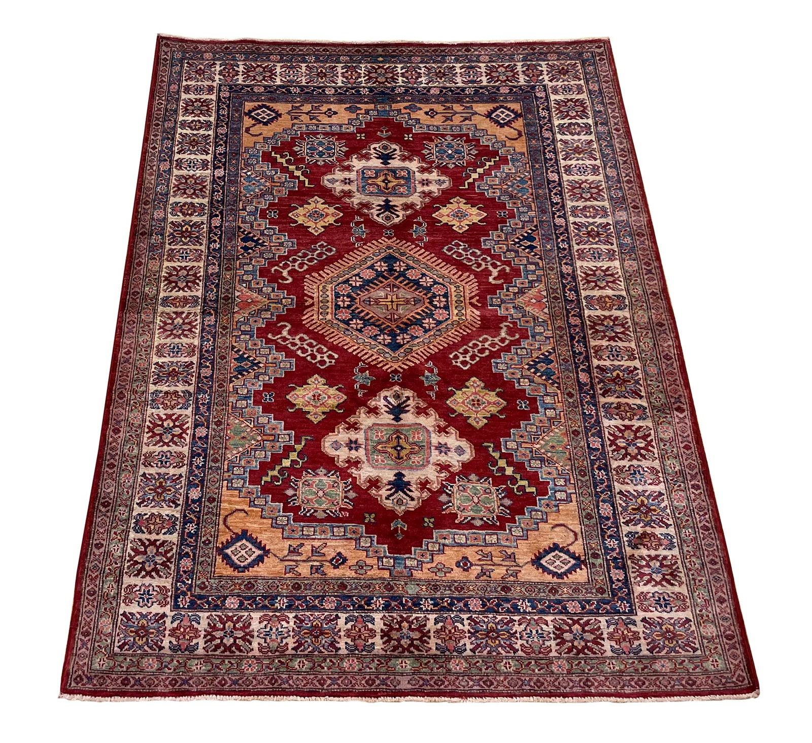 Persian Kazak D177 6' x 4'10" hand knotted tribal design: No Reserve Kazak D177 This 6'x4'10" rug showcases a traditional Persian tribal design characterized by its bold geometric medallion pattern and rich color palette. The deep red field features a striki