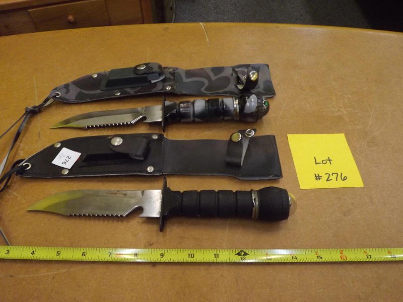 TWO DAGGERS: TWO DAGGERS WITH COMPASS HANDLES IN SHEATH WITH SHARPENING STONE, BOTH MADE IN TAIWAN