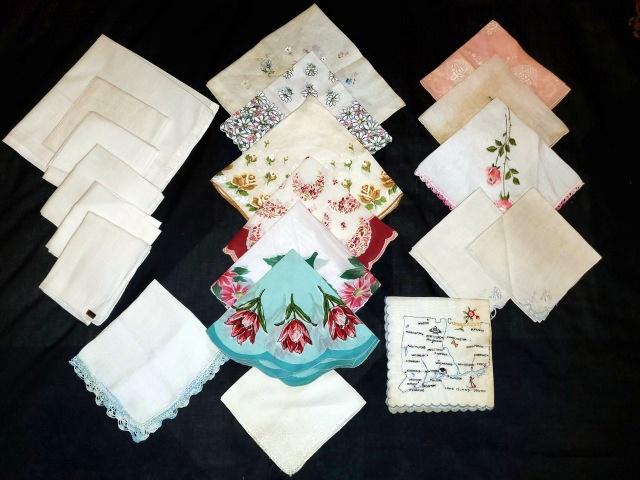 Vintage Handkerchief Grouping: 19 vintage handkerchiefs including several plain, 7 printed including a round one, a few embroidered including a souvenir handkerchief from Connecticut. Many have storage discoloration that should soa