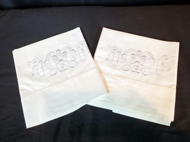 Pair of Cotton Embroidered Pillowcases - Flower: Pair of white Cotton Machine Embroidered Pillowcases with pale blue flower motif. Measures 19 inches by 32 inches. Never used, no issues noted. In house Flat Rate Shipping is an estimate. I will gladl