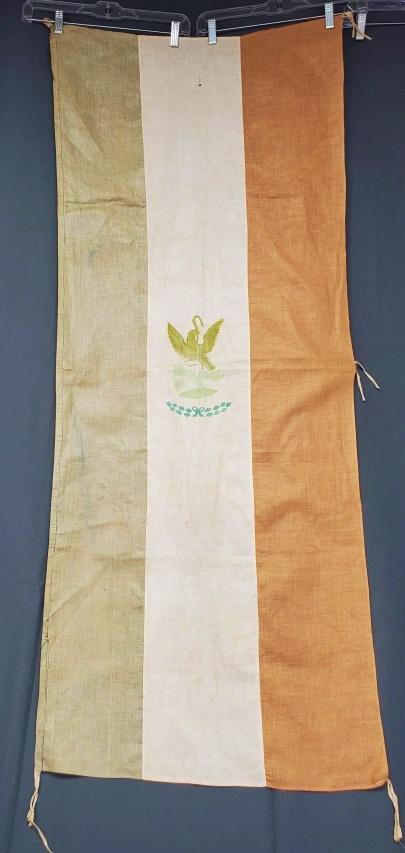Vintage Mexican Flag Banner: Vintage Flag of Mexico Banner measuring 24x58 inches. Ties at each corner and in the middle along the right edge. Condition is fair, very faded, small hole, and water spots. In house Flat Rate Shippin