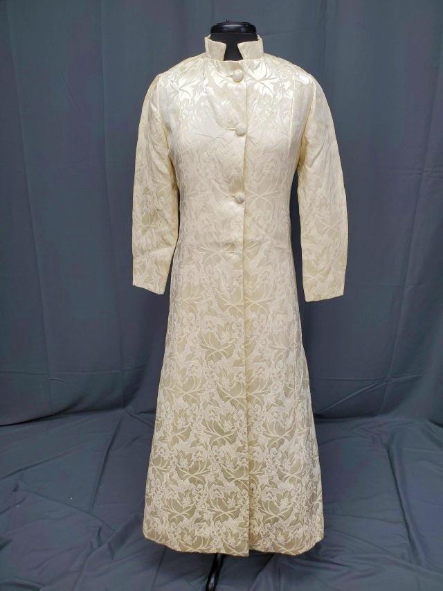 Vintage Ivory Damask Ladies Coat or Duster: Vintage Ivory Damask Ladies Coat or Duster in today's size extra small, 51 inches long from the shoulder. In very good condition, missing one button and a few dirt scuff marks. From the estate of a se