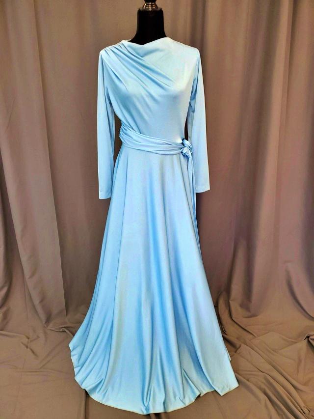 Vintage Blue Ladies Maxi Dress: Vintage 1970s-1980s Baby Blue Maxi Dress with long sleeves, rouching on one shoulder, A-line skirt with belt, back zip closure. this dress is a waterfall. Fabric is a synthetic and reflects light beau
