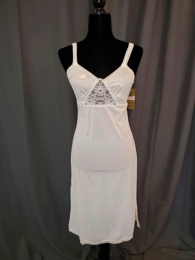 Five Movie Star Lingerie Old Stock: Five Movie Star Lingerie, old stock, includes three ivory size 32, 1 champagne size 32, and one black size 32, all are 100% nylon, with lace embellished bodice and gored skirt, four are still in origi