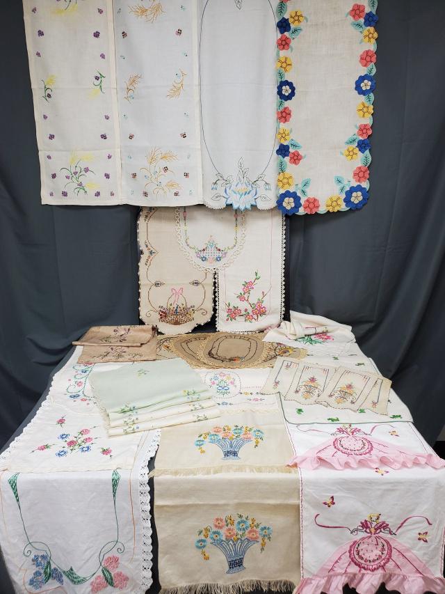 30 Vintage Embroidered Dresser Scarves: Group of 30 Vintage Linen Dresser Scarves or Table Runners, in various sizes, all are hand embroidered. Includes several pairs: pair with wheat, pair with baskets of flowers, pair with Southern Belle